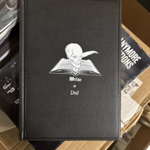 A black notebooks with "Write or Die" on it.